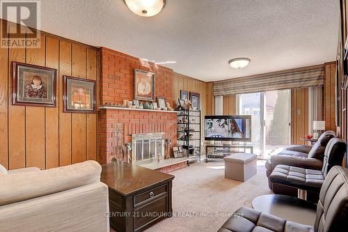 304 Goldhawk Trail, Toronto (Milliken), ON - Indoor Photo Showing Living Room With Fireplace