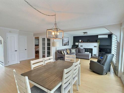 Vue d'ensemble - 14 Rue St-Jean-Batiste S., Ville-Marie, QC - Indoor Photo Showing Dining Room With Fireplace