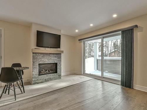 Living room - 1303 Ch. De La Rivière, Val-David, QC - Indoor Photo Showing Living Room With Fireplace