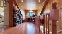 Landing on the second floor is a great office or den space. - 