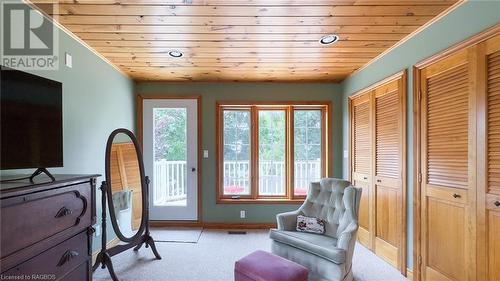 Primary bedroom with dormer window, sitting area and balcony overlooking the lake. - 46 Bell Drive, Huron-Kinloss, ON - Indoor Photo Showing Other Room