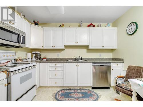 933 Harvey Avenue Unit# 110, Kelowna, BC - Indoor Photo Showing Kitchen With Double Sink