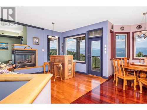 9265 Kokanee Road, Vernon, BC - Indoor Photo Showing Dining Room With Fireplace