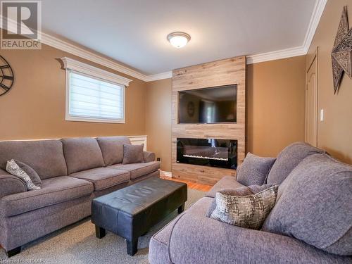 203 Orchard Road, Woodstock, ON - Indoor Photo Showing Living Room With Fireplace