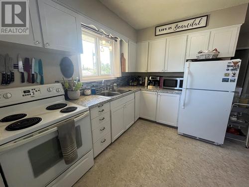 317 100 Avenue, Dawson Creek, BC - Indoor Photo Showing Kitchen With Double Sink