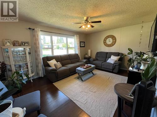 317 100 Avenue, Dawson Creek, BC - Indoor Photo Showing Living Room With Fireplace