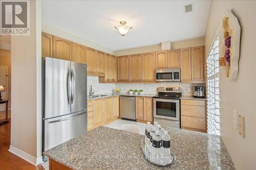 509 - 1499 Nottinghill Gate, Oakville (Glen Abbey), ON - Indoor Photo Showing Kitchen With Double Sink