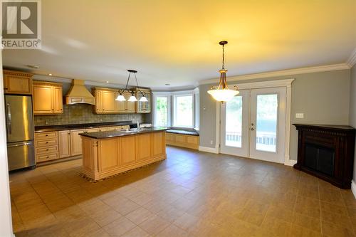 11 Hoyles Road, Carbonear, NL - Indoor Photo Showing Kitchen With Fireplace