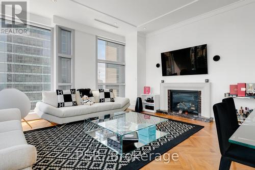 2503 - 183 Wellington Street W, Toronto, ON - Indoor Photo Showing Living Room With Fireplace