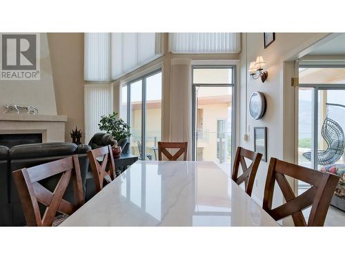 250 Marina Way Unit# 804, Penticton, BC - Indoor Photo Showing Dining Room With Fireplace