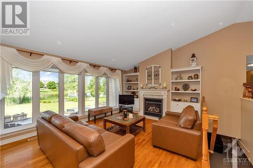 6923 Lakes Park Drive, Greely, ON - Indoor Photo Showing Living Room With Fireplace