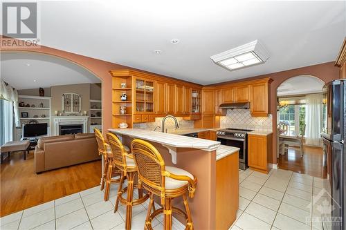 6923 Lakes Park Drive, Greely, ON - Indoor Photo Showing Kitchen With Fireplace