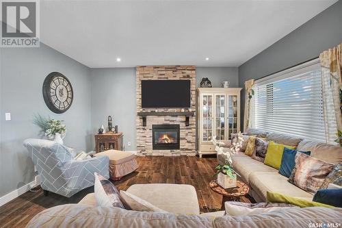 551 Redwood Crescent, Warman, SK - Indoor Photo Showing Living Room With Fireplace