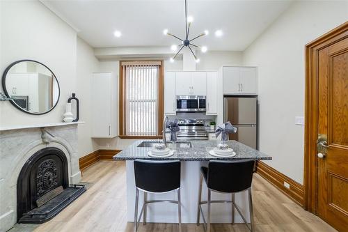 82 Victoria Avenue S, Hamilton, ON - Indoor Photo Showing Kitchen With Fireplace