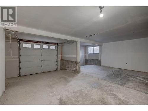 7884 Alpine Road, Kelowna, BC - Indoor Photo Showing Garage