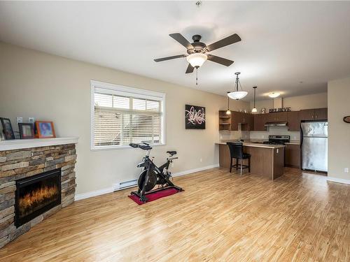 303-2115 Meredith Rd, Nanaimo, BC - Indoor Photo Showing Living Room With Fireplace