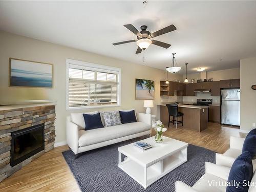 303-2115 Meredith Rd, Nanaimo, BC - Indoor Photo Showing Living Room With Fireplace