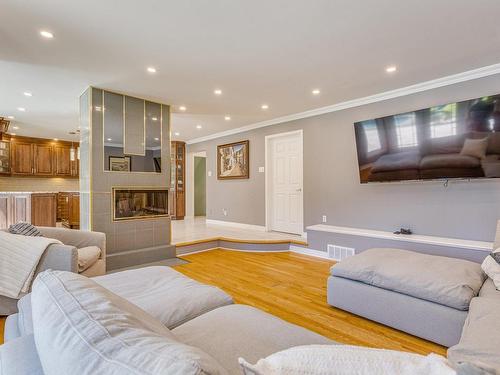 Salon - 1207 Rue Jean-Vincent, Carignan, QC - Indoor Photo Showing Living Room With Fireplace