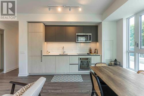 417 - 150 Logan Avenue, Toronto (South Riverdale), ON - Indoor Photo Showing Kitchen With Upgraded Kitchen