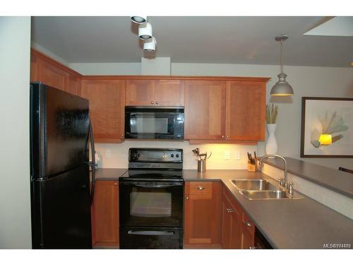 232/234-1999 Country Club Way, Langford, BC - Indoor Photo Showing Kitchen With Double Sink