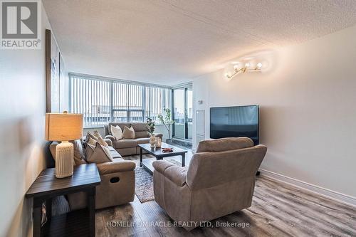 1708 - 65 Huntingdale Boulevard, Toronto (L'Amoreaux), ON - Indoor Photo Showing Living Room With Fireplace