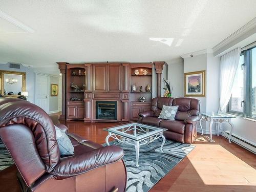 Autre - 1206-500 Rue St-Francois, Brossard, QC - Indoor Photo Showing Living Room With Fireplace