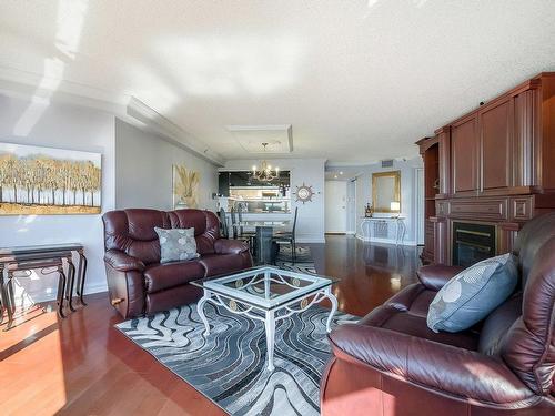 Vue d'ensemble - 1206-500 Rue St-Francois, Brossard, QC - Indoor Photo Showing Living Room With Fireplace