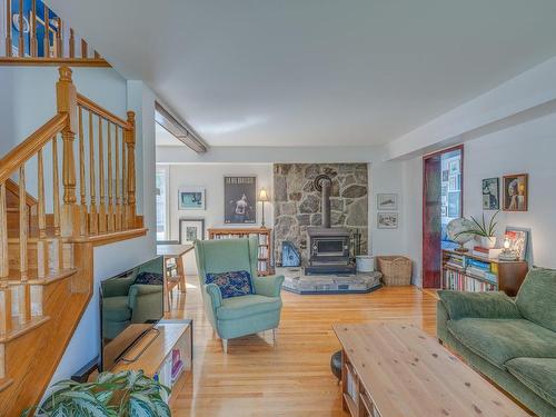 Living room - 38 Av. De Hautmont, Lorraine, QC - Indoor Photo Showing Living Room With Fireplace