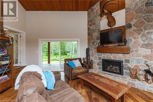 855 Highway 17 E, Bonfield, ON - Indoor Photo Showing Living Room With Fireplace