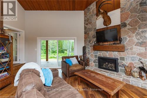 855 Highway 17 E, Bonfield, ON - Indoor Photo Showing Living Room With Fireplace