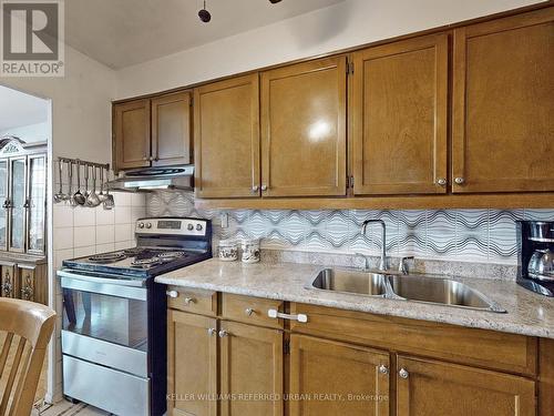 1111 - 10 Parkway Forest Drive, Toronto (Henry Farm), ON - Indoor Photo Showing Kitchen With Double Sink