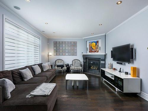 Salon - 3995 Rue Fernand-Dumont, Montréal (Saint-Laurent), QC - Indoor Photo Showing Living Room With Fireplace