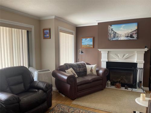 10-4404 Pleasant Valley Road, Vernon, BC - Indoor Photo Showing Living Room With Fireplace