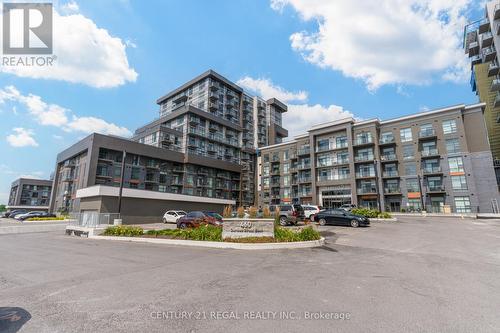 702 - 460 Dundas Street E, Hamilton (Waterdown), ON - Outdoor With Facade