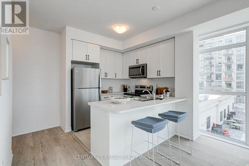 702 - 460 Dundas Street E, Hamilton (Waterdown), ON - Indoor Photo Showing Kitchen With Stainless Steel Kitchen