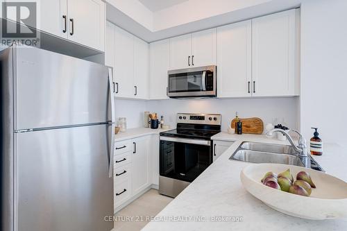 702 - 460 Dundas Street E, Hamilton (Waterdown), ON - Indoor Photo Showing Kitchen With Stainless Steel Kitchen With Double Sink