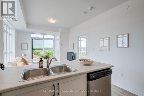 702 - 460 Dundas Street E, Hamilton (Waterdown), ON - Indoor Photo Showing Kitchen With Double Sink