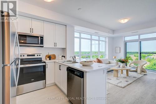 702 - 460 Dundas Street E, Hamilton (Waterdown), ON - Indoor Photo Showing Kitchen With Stainless Steel Kitchen With Double Sink