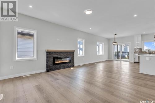 576 Kalra Street, Saskatoon, SK - Indoor Photo Showing Living Room With Fireplace