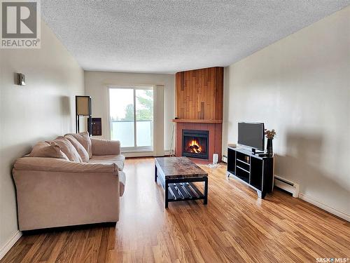 310 423 Tait Court, Saskatoon, SK - Indoor Photo Showing Living Room With Fireplace