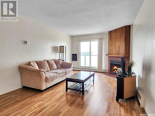 310 423 Tait Court, Saskatoon, SK - Indoor Photo Showing Living Room With Fireplace