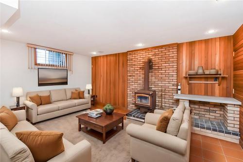 Virtually Staged - 22 Glen Park Court, Hamilton, ON - Indoor Photo Showing Living Room With Fireplace