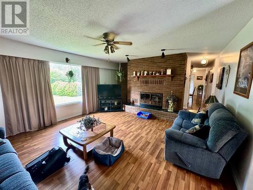 14446 2 Highway, Dawson Creek, BC - Indoor Photo Showing Living Room With Fireplace