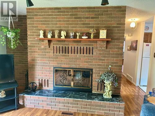 14446 2 Highway, Dawson Creek, BC - Indoor Photo Showing Living Room With Fireplace