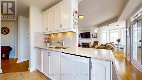 302 - 10 Bay Street E, Blue Mountains (Thornbury), ON - Indoor Photo Showing Kitchen With Fireplace With Double Sink