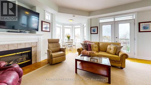 302 - 10 Bay Street E, Blue Mountains (Thornbury), ON - Indoor Photo Showing Living Room With Fireplace