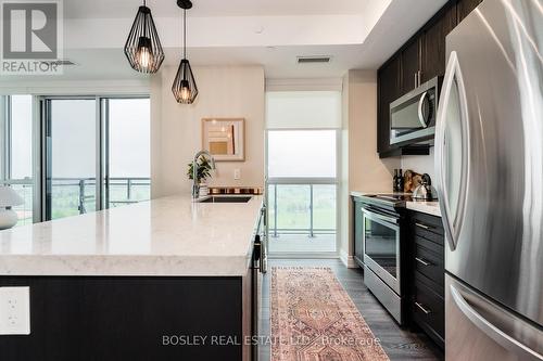 908 - 1050 Main Street E, Milton (Dempsey), ON - Indoor Photo Showing Kitchen With Stainless Steel Kitchen With Upgraded Kitchen