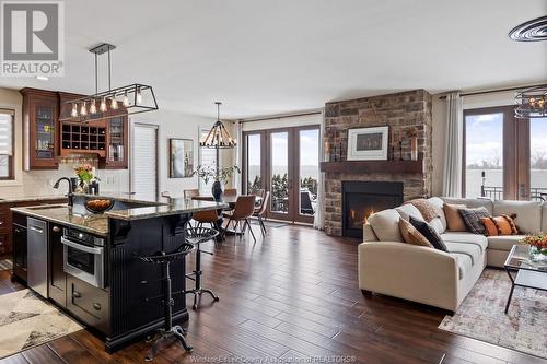 8748 Riverside Drive East, Windsor, ON - Indoor Photo Showing Living Room With Fireplace