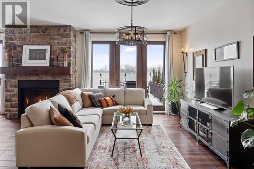 8748 Riverside Drive East, Windsor, ON - Indoor Photo Showing Living Room With Fireplace