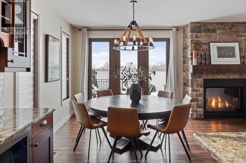 8748 Riverside Drive East, Windsor, ON - Indoor Photo Showing Dining Room With Fireplace